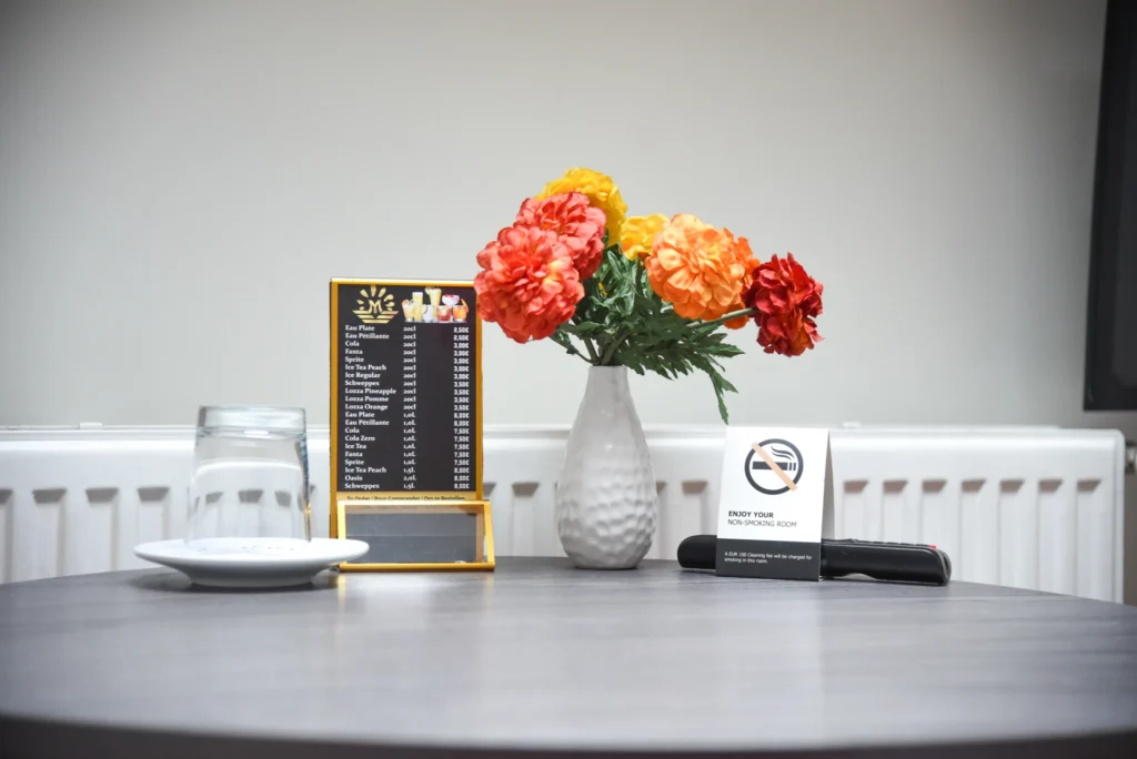Hotel room amenities at La Bourse Hotel Brussels including WiFi, air conditioning, private bathroom, and modern comfort features in central Brussels